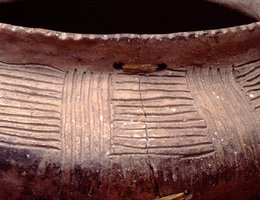 This Oneota pot was cracked and then repaired with sinew laced through small holes