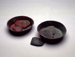 Trade goods used by the historic Pawnee included brass pans containing red and green pigments which were applied with pieces of porous bone