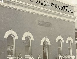 Morton standing in the doorway of the building where he printed "The Conservative"
