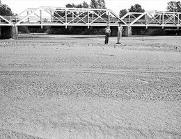 View of the dry bed of the Platte River south of Grand Island under a bridge on Highway 281, July 25, 1936
