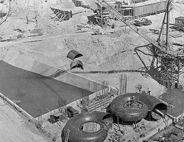The Central District’s Jeffrey Hydroplant during early stages of construction. The spiral cases that carry water from the penstocks to the turbines are displayed prominently.