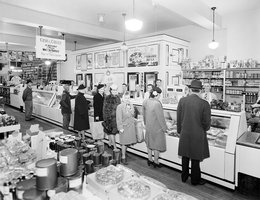 Customers shopping at the meat counter in Freadrich Bros. Cash & Carry Market, 1945
