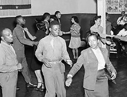 Celebrating "Victory over Japan" day at the segregated 12th Street USO Club in Lincoln, August 1945