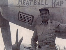 Lieutenant Colonel Charles Lane, Jr., Tuskegee Airman, 99th Fighter Squadron, U.S. Air Force, and his plane, Meatball