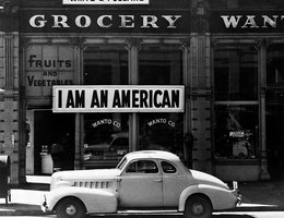The owner of this Oakland, California store, a University of California graduate of Japanese descent, placed the "I AM AN AMERICAN" sign on his store front on December 8, 1941, the day after Pearl Harbor