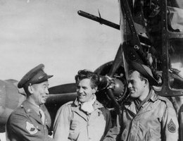 Kuroki shakes hands with "Tupelo Lass" ground crew member, Art Ferwerda, prior to the Ploesti, Rumania raid of August 1, 1943
