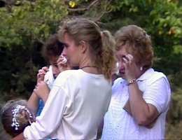 Women upset at an auction for a foreclosed farm