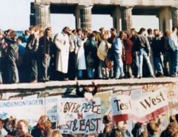 Germans stand on top of the wall at the Brandenburg Gate in the Berlin Wall in 1989