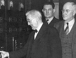 U.S. Senator George Norris, with George E. Johnson observing, pulls the switch at the Jeffrey Hydroplant to bring the plant on line for the first time on Jan. 5, 1941