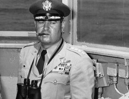 Gen. Curtis LeMay in an unfamiliar setting, the bridge of a Navy ship, watching one of the early atomic bomb tests that SAC carried out